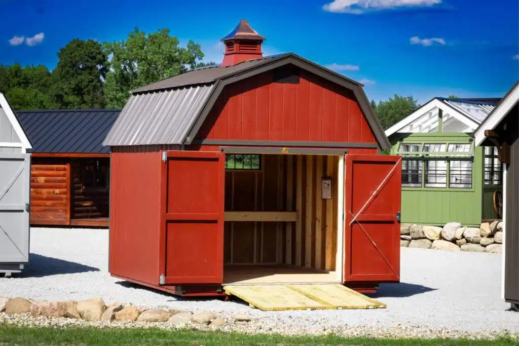 Red Storage barn featuring a copula and brown roof and accents in Fremont IN