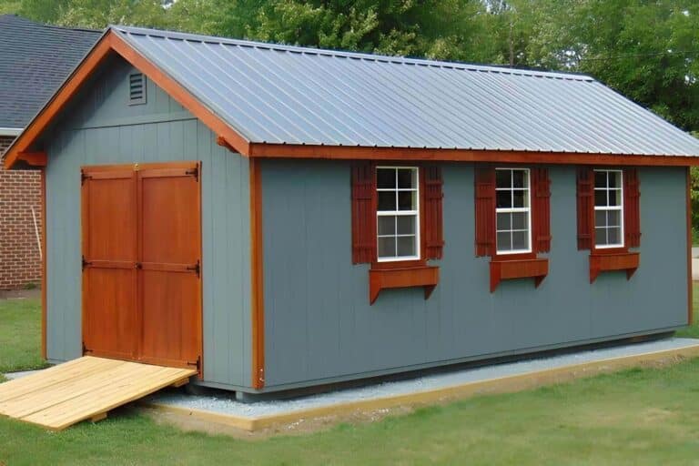 Gable garage in gray and brown with ramp and windows