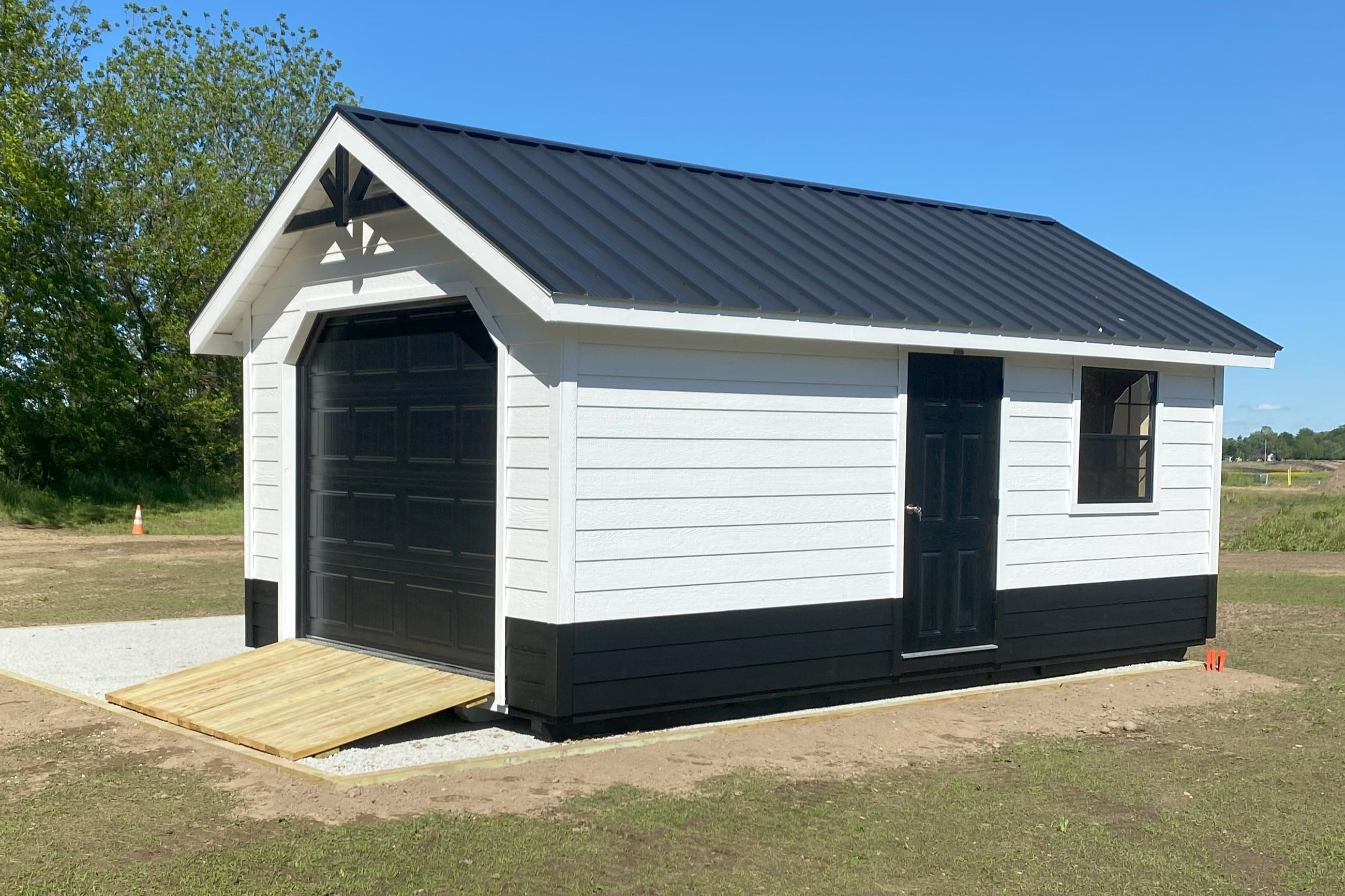 Black & White Storage Shed Garage on Garvel Foundation in backyard